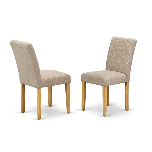 Two beige upholstered dining chairs with wooden legs