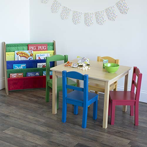 Colorful kids' playroom with table, chairs, and book rack.