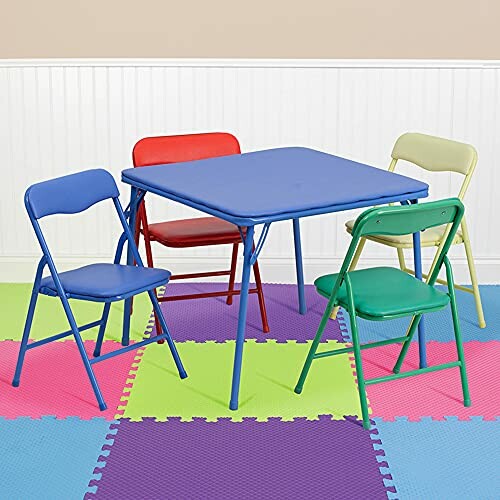 Colorful kids table with four folding chairs on foam play mat