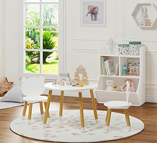 Children's playroom with table, chairs, and toys.