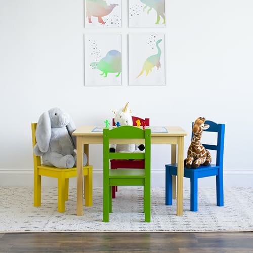 Colorful children's table and chairs with stuffed animals in a playroom.