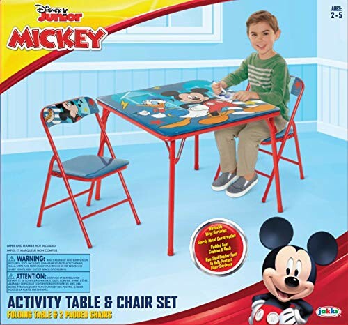 Child sitting at a Mickey Mouse themed activity table and chair set.